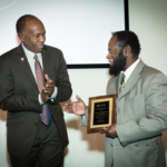 Dr. Sam Adunyah receiving award